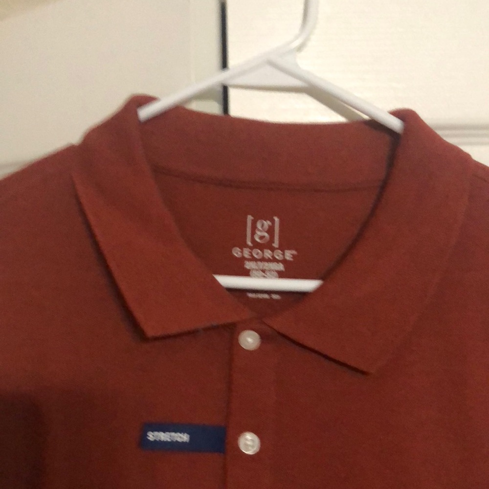Short sleeve polo shirt. Never been worn. Smoke free environment.